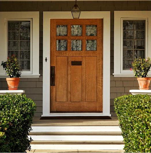 front porch of home with American flag